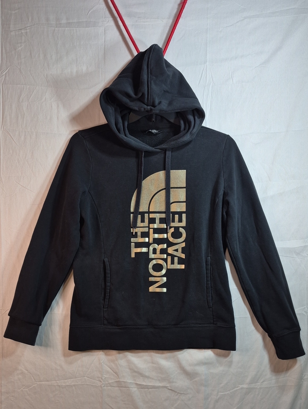 The North Face Black Hoodie with Gold Logo Print